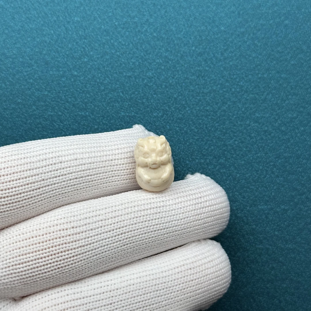 D64-81天然猛犸牙 瑕疵特价龙宝宝10*14.5*10mm支持复检假一罚十