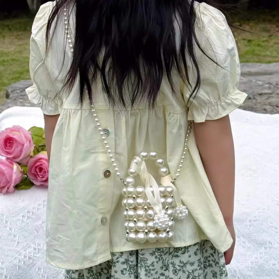 2025夏季宝宝洋气珍珠手拎包mini女孩公主斜挎时尚出游配饰零钱包