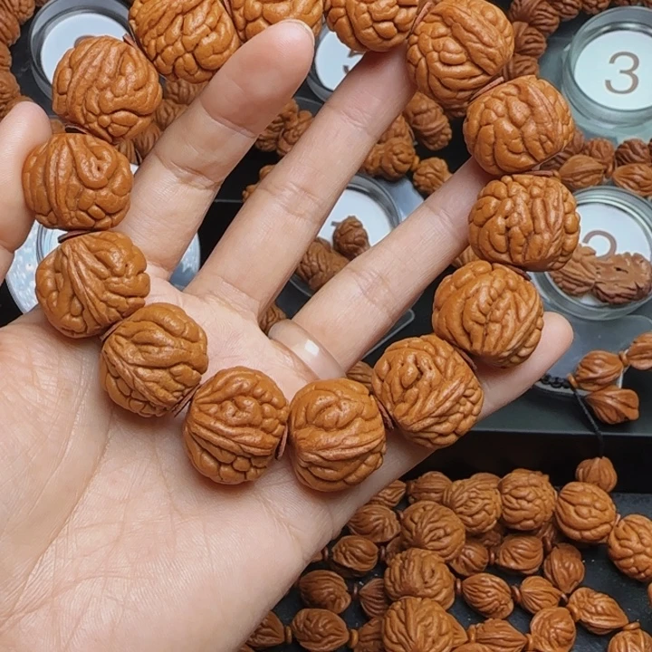 笑***生手串桃核龙纹桃核