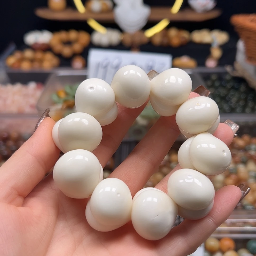 手串菩提根/象牙果瑕疵26加白皮桃1条上下孔表面有眼有裂