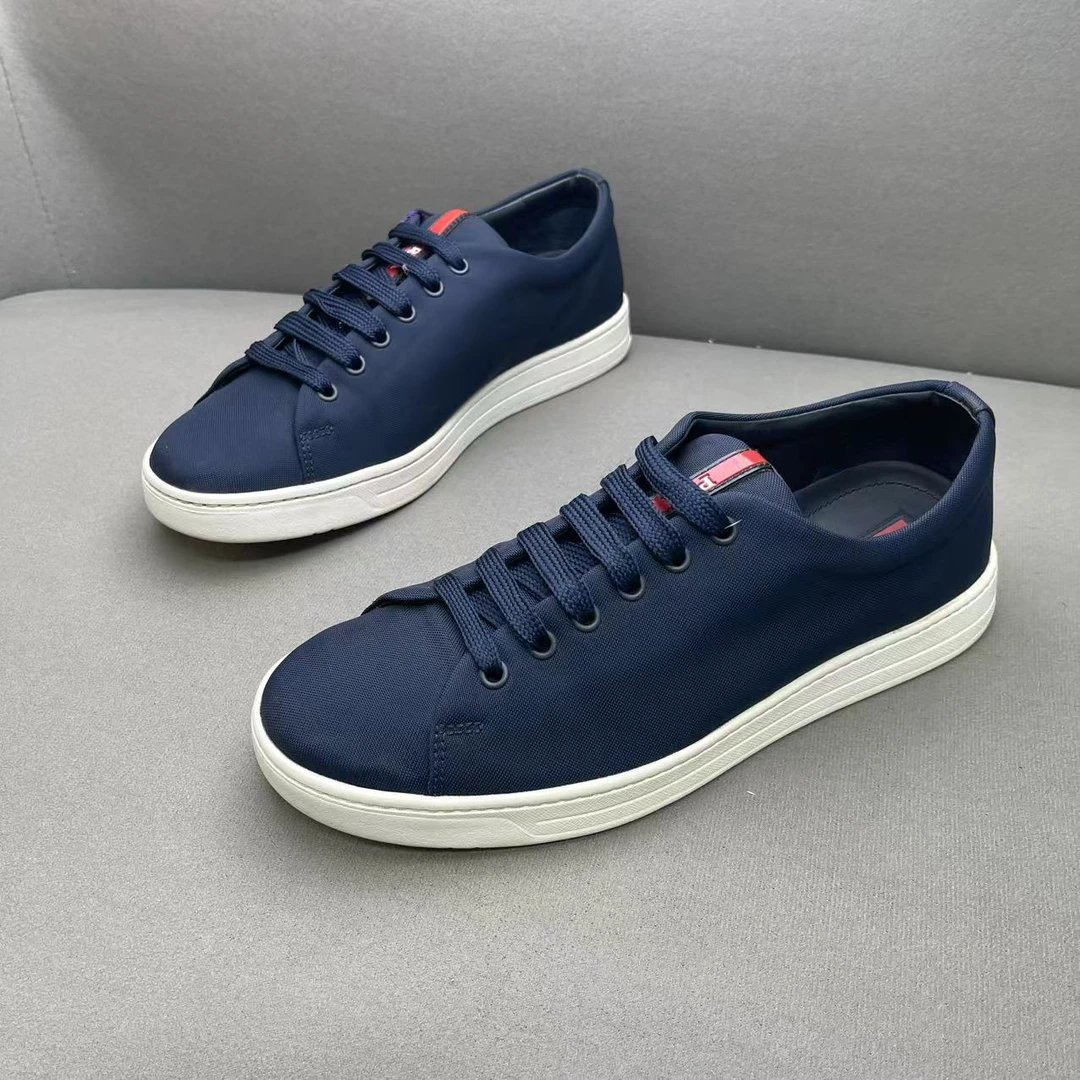 95新 Prada/普拉达 蓝色网面鞋舌红标logo时尚百搭板鞋 40.5码