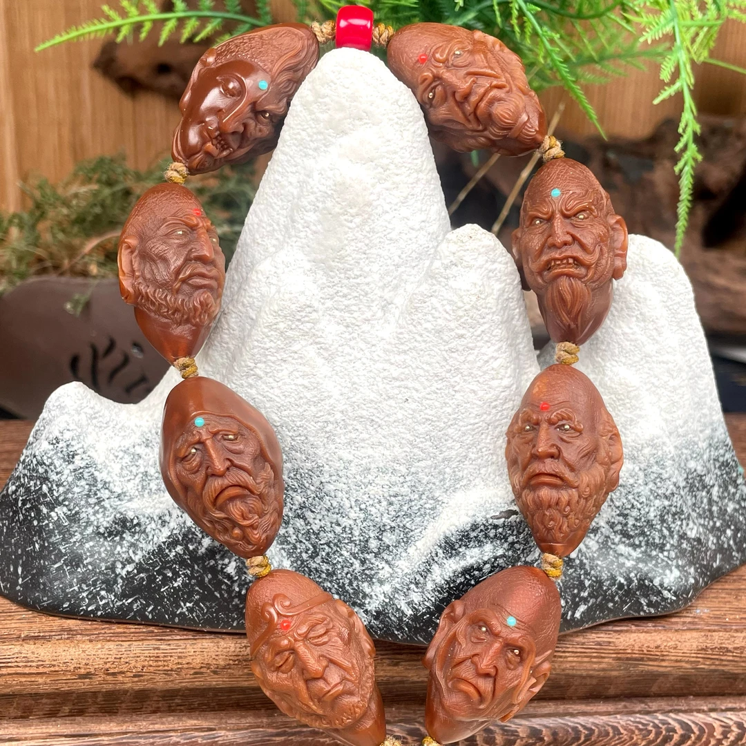 藏越，镶嵌版包浆料七星罗汉橄榄核雕手串