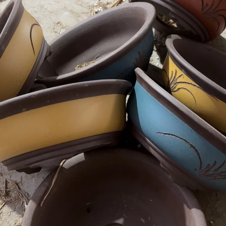 紫砂花盆100-7。  24-9