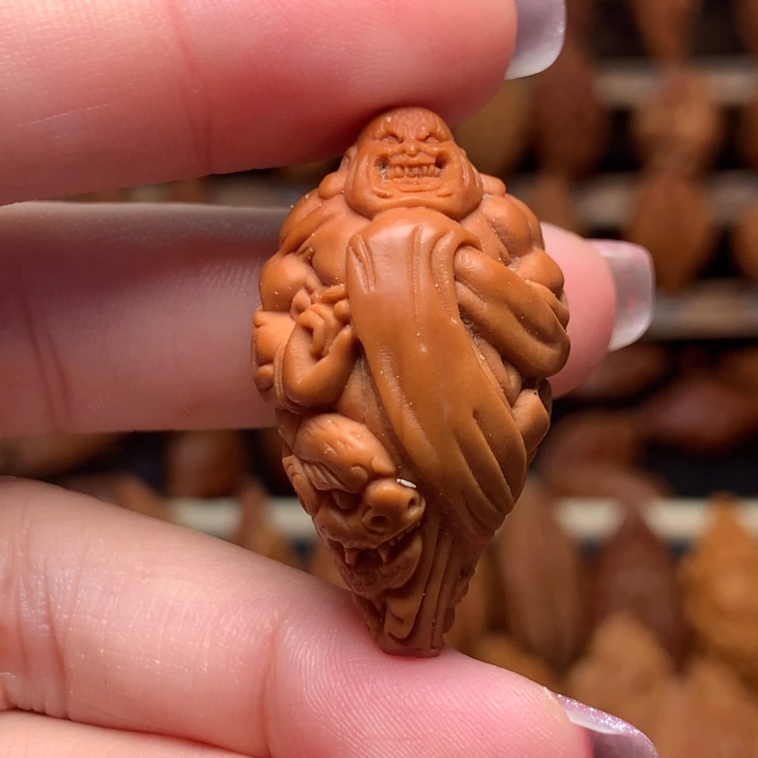 把件橄榄核强招恶僧