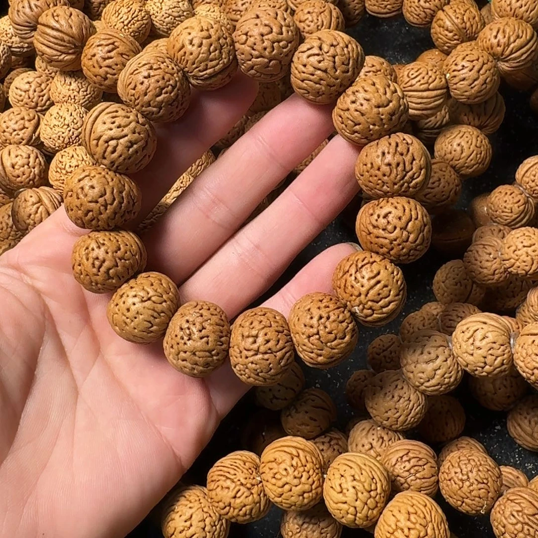 奋***谭吊坠桃核苹果园手串