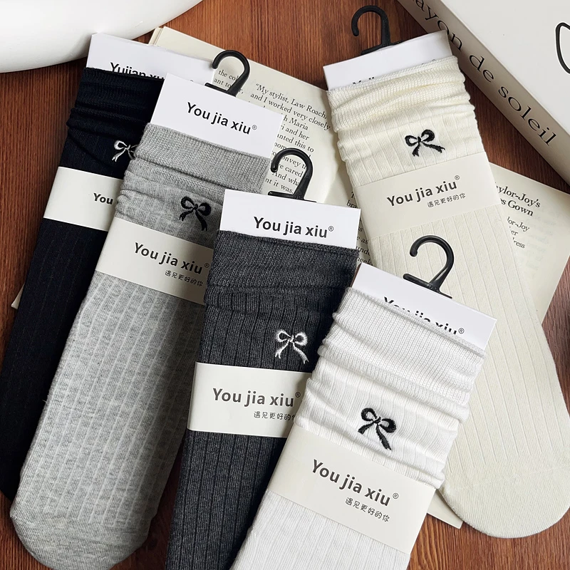 蝴蝶结袜子女秋冬款中筒棉袜可爱长袜韩国无骨堆堆袜女搭配小皮鞋