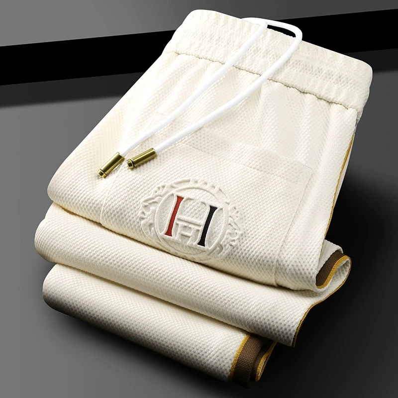 休闲运动裤男夏季薄款轻奢级菠萝格百搭侧边织带字母凸印卫裤男士