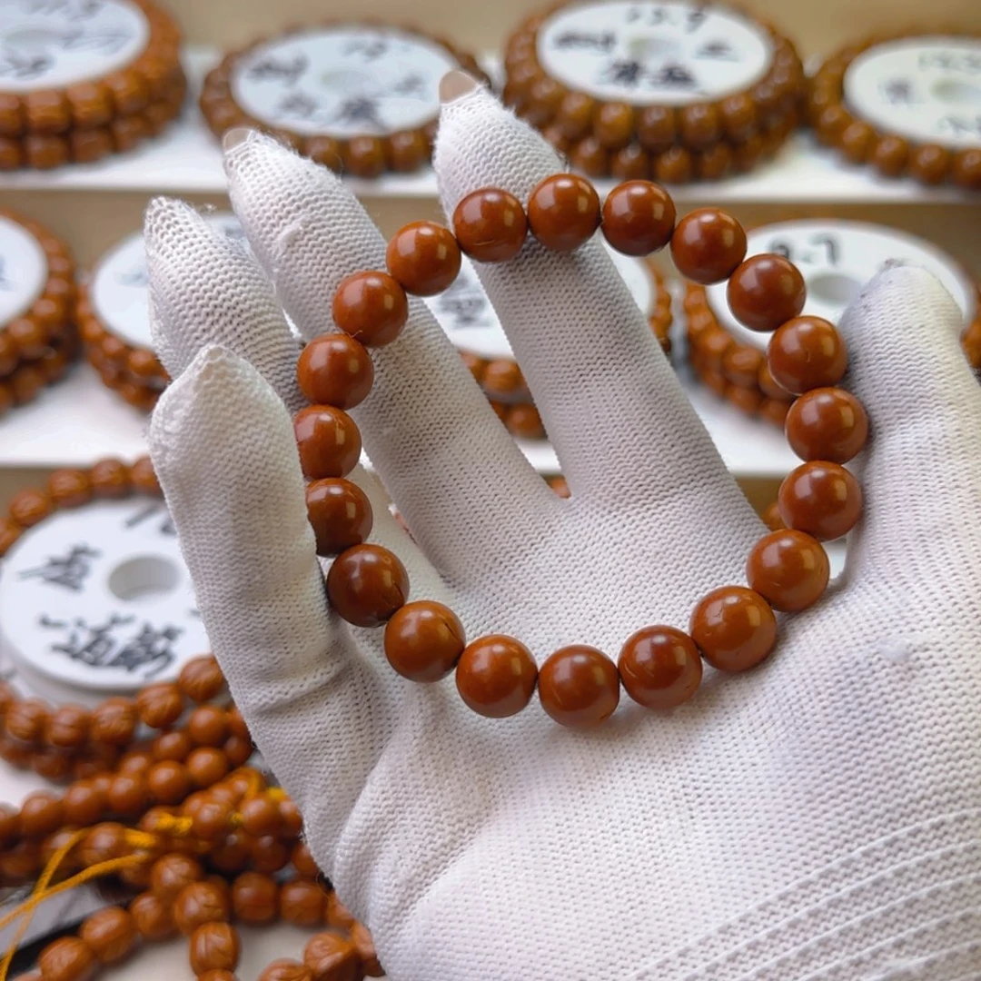 桃核手串卖*鹤龙纹正圆光珠桃核