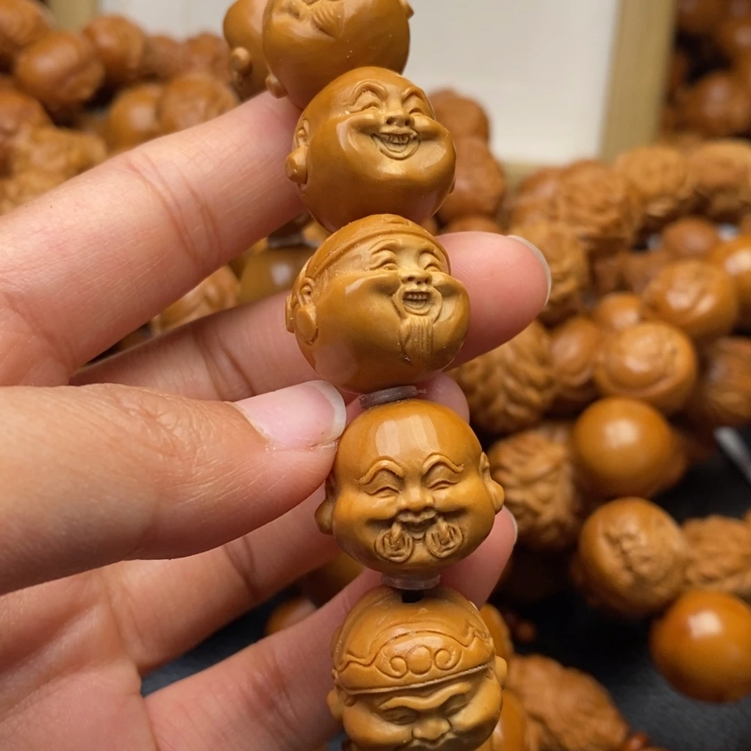 伈***痕橄榄核手串财迷头1.8