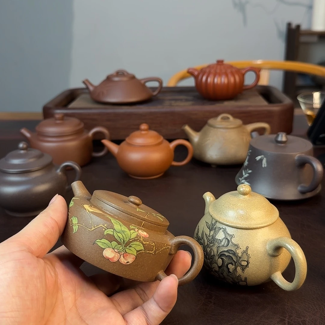 紫砂茶壶左**右紫砂壶茶具手工制作的