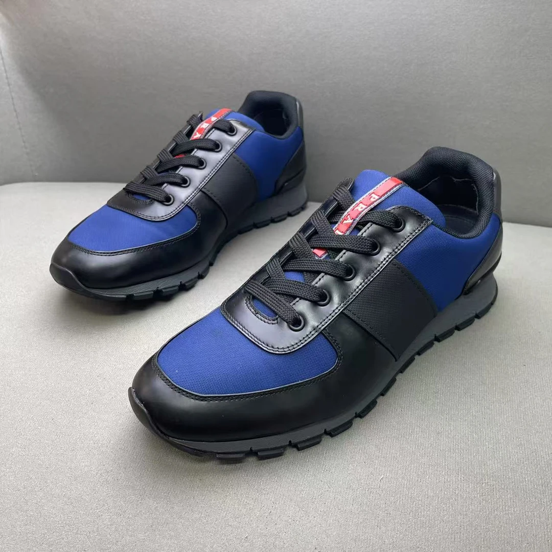 95新 Prada/普拉达 黑蓝拼色鞋舌红标logo时尚百搭运动鞋 43码