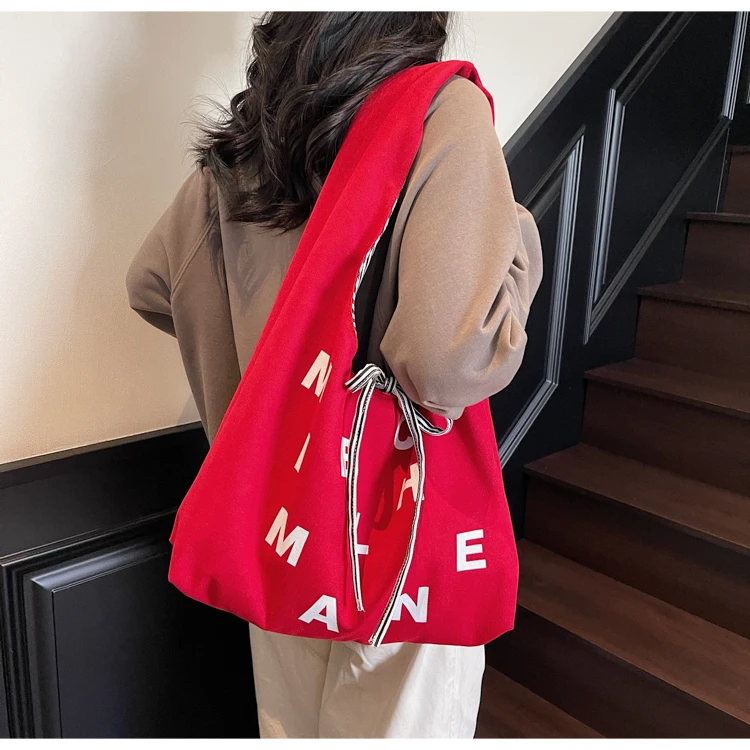 大容量休闲正反两面条纹帆布包女2025新款单肩包