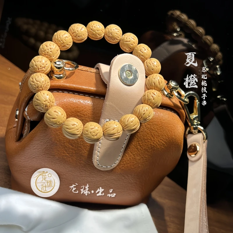 “夏橙”东北盘锦桃核手串【龙珠社国核】抛光(尺寸误差0.5mm之间)