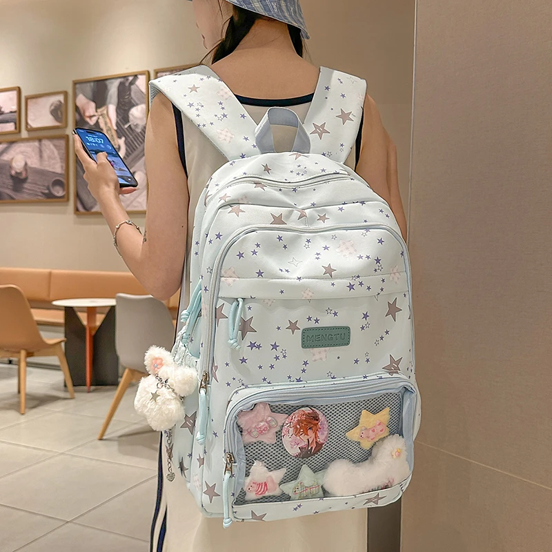 可爱卡通星星双肩包女2025新款书包初中女生大容量旅游轻便背包