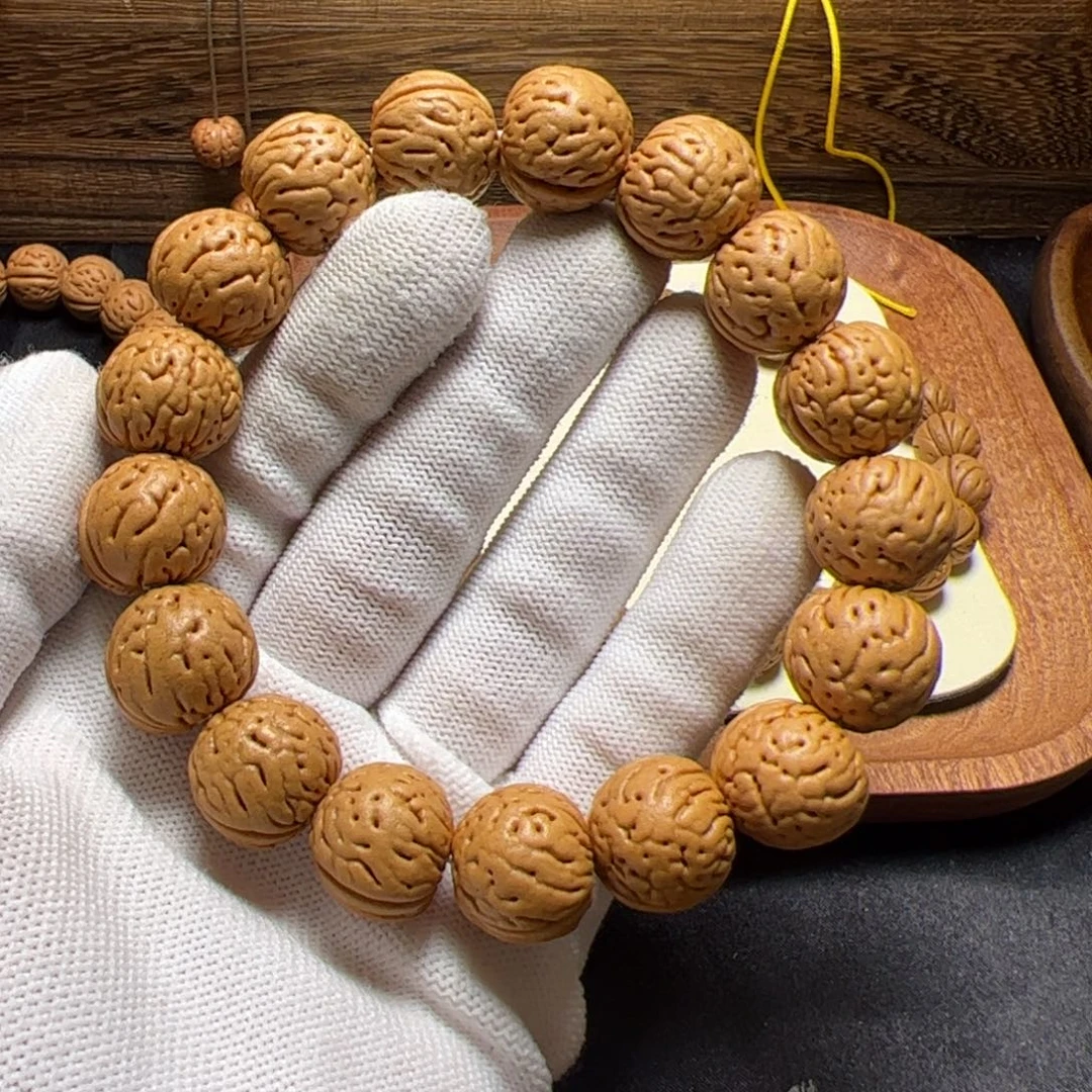 布***爸17左右金丹桃核手串全品