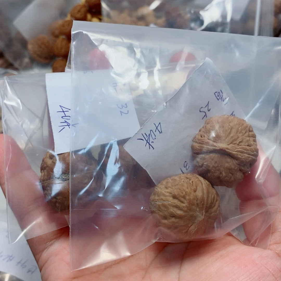 默***默文玩核桃吊坠元宝手捻2对