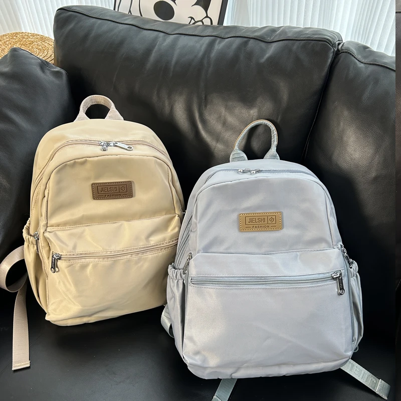 新品小众出游双肩包大容量防泼水背包厚肩带通勤出游书包妈咪包