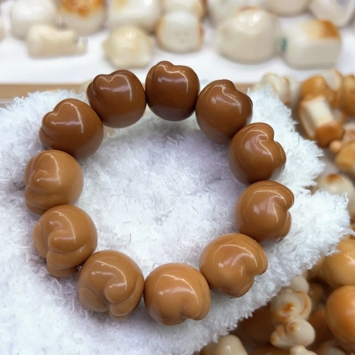 白玉菩提把件77 象牙果原果雕刻风化爱心熊爪微瑕