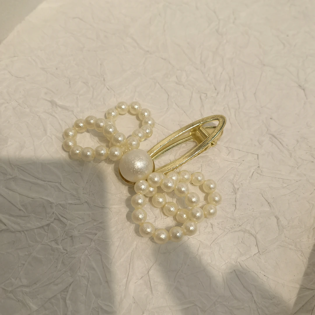 E274白色珠蝴蝶结边夹