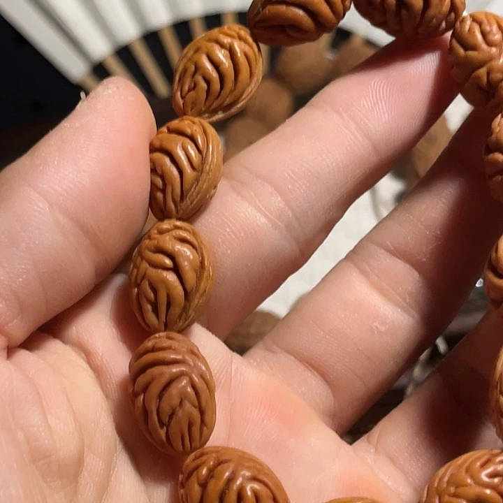 天***。碧桃核肌肉纹手串