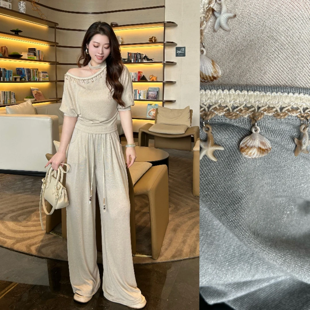 【心仪假日】HZ夏款清凉显瘦舒适度假松弛重工手工贝壳编制链两件套