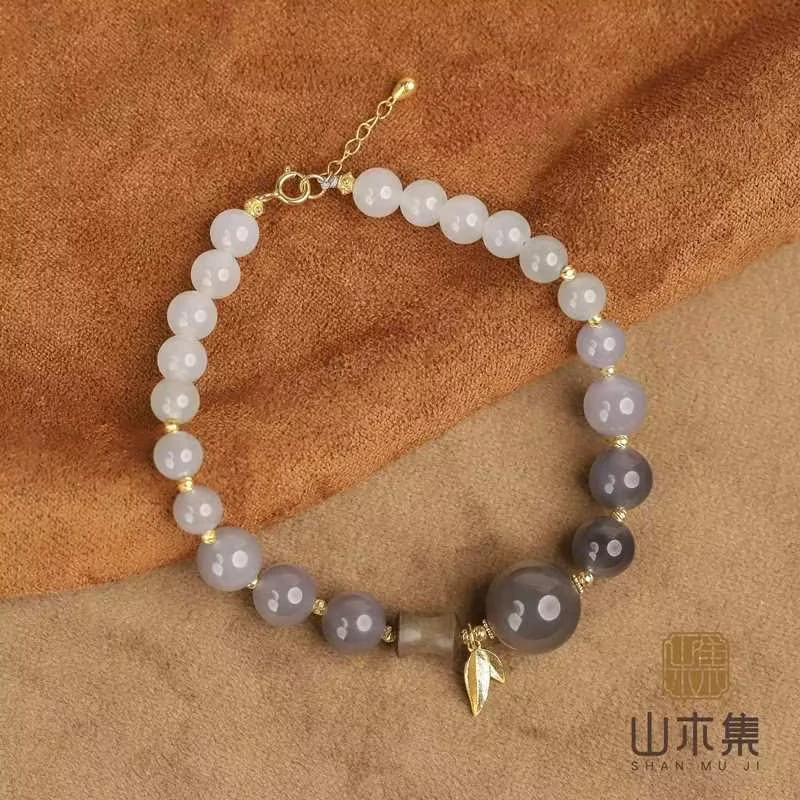 【竹石吟】（18K金）老山檀阴沉料渐变烟紫和田玉单圈手串￥（多样性）