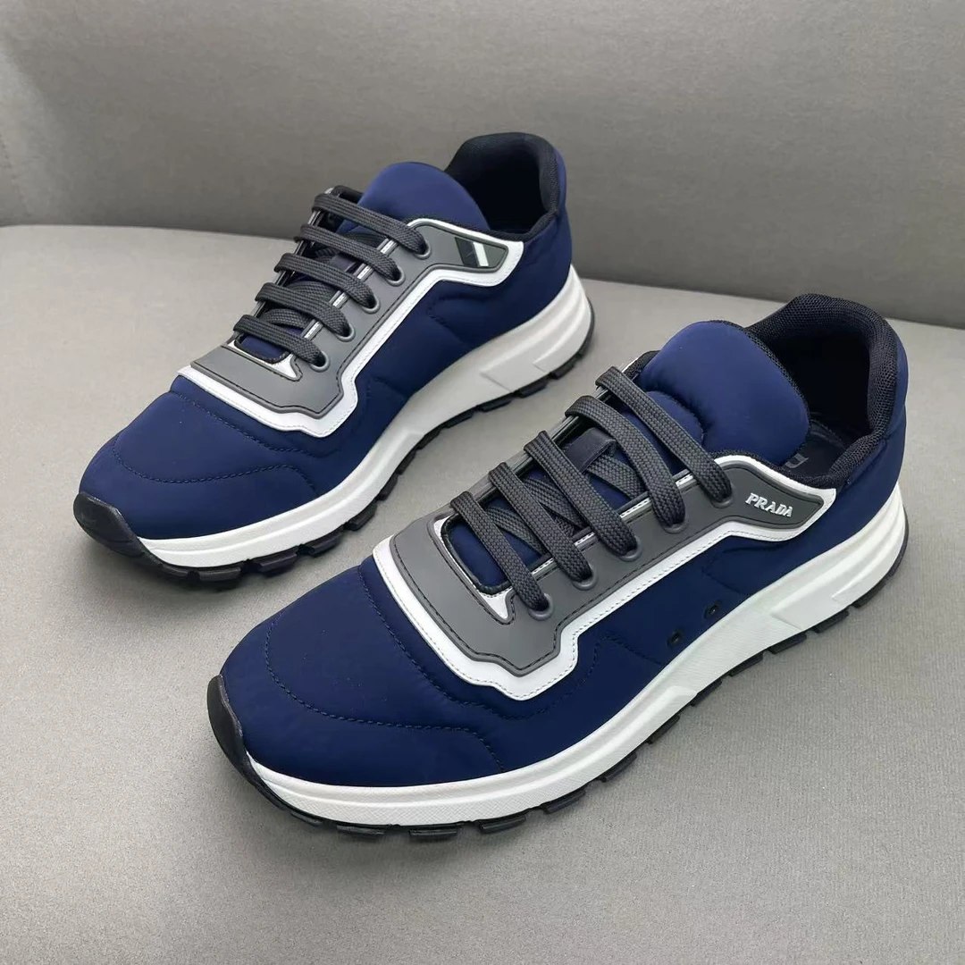 95新 Prada/普拉达 蓝色时尚百搭冲锋衣皮革面拼接运动鞋 43码
