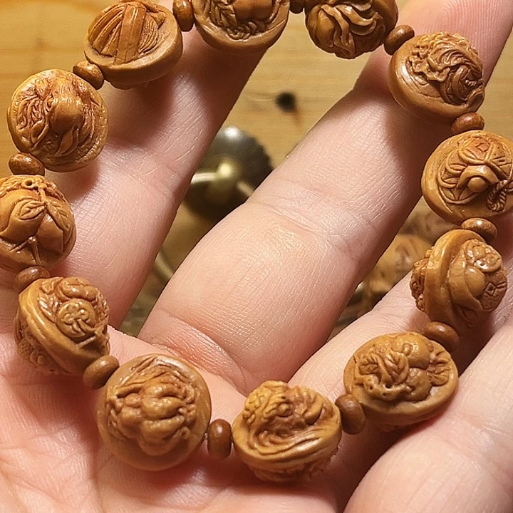 知***阁龙纹桃核雕刻多宝手串