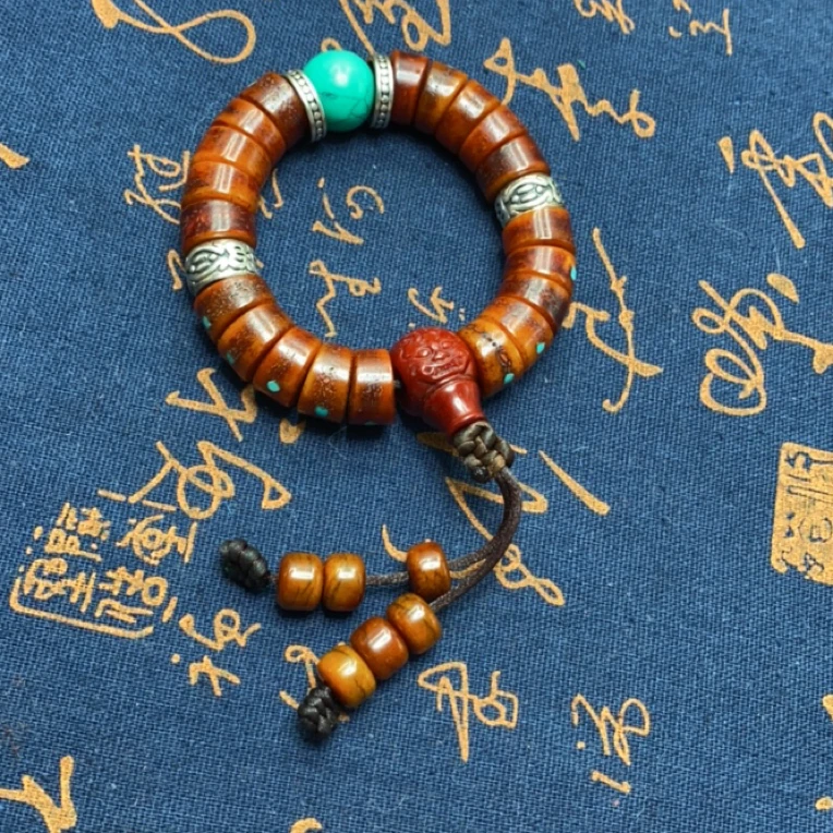 西藏老料牦牛骨眉心嘎嘎镶嵌万字，松手串