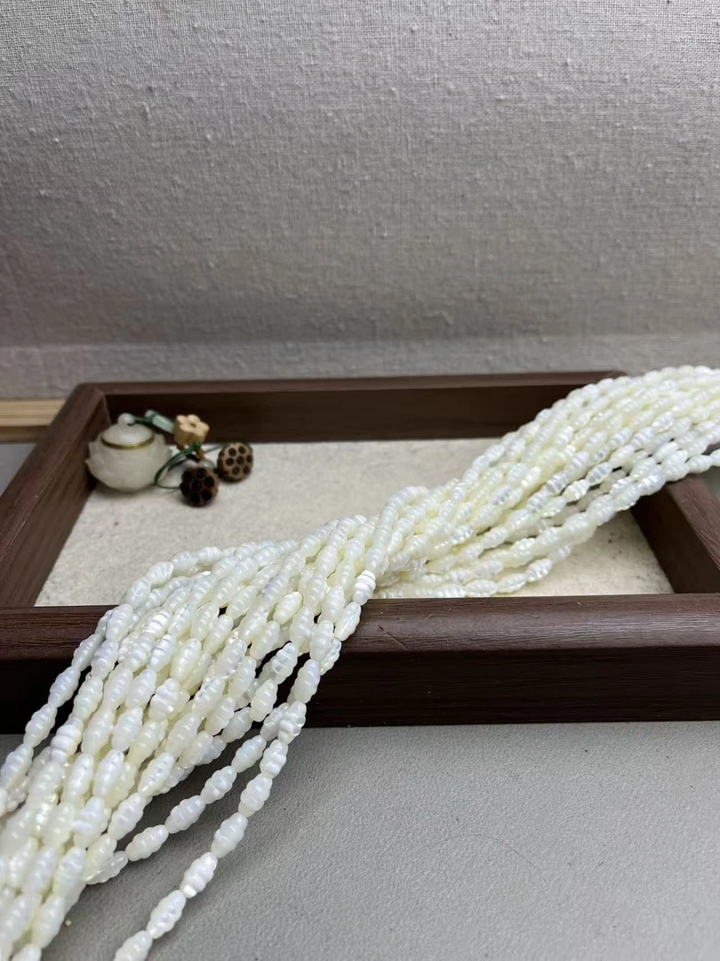 天然5/9mm左右海水白蝶贝雕刻珠带猫眼散珠半成品长度40cm左右