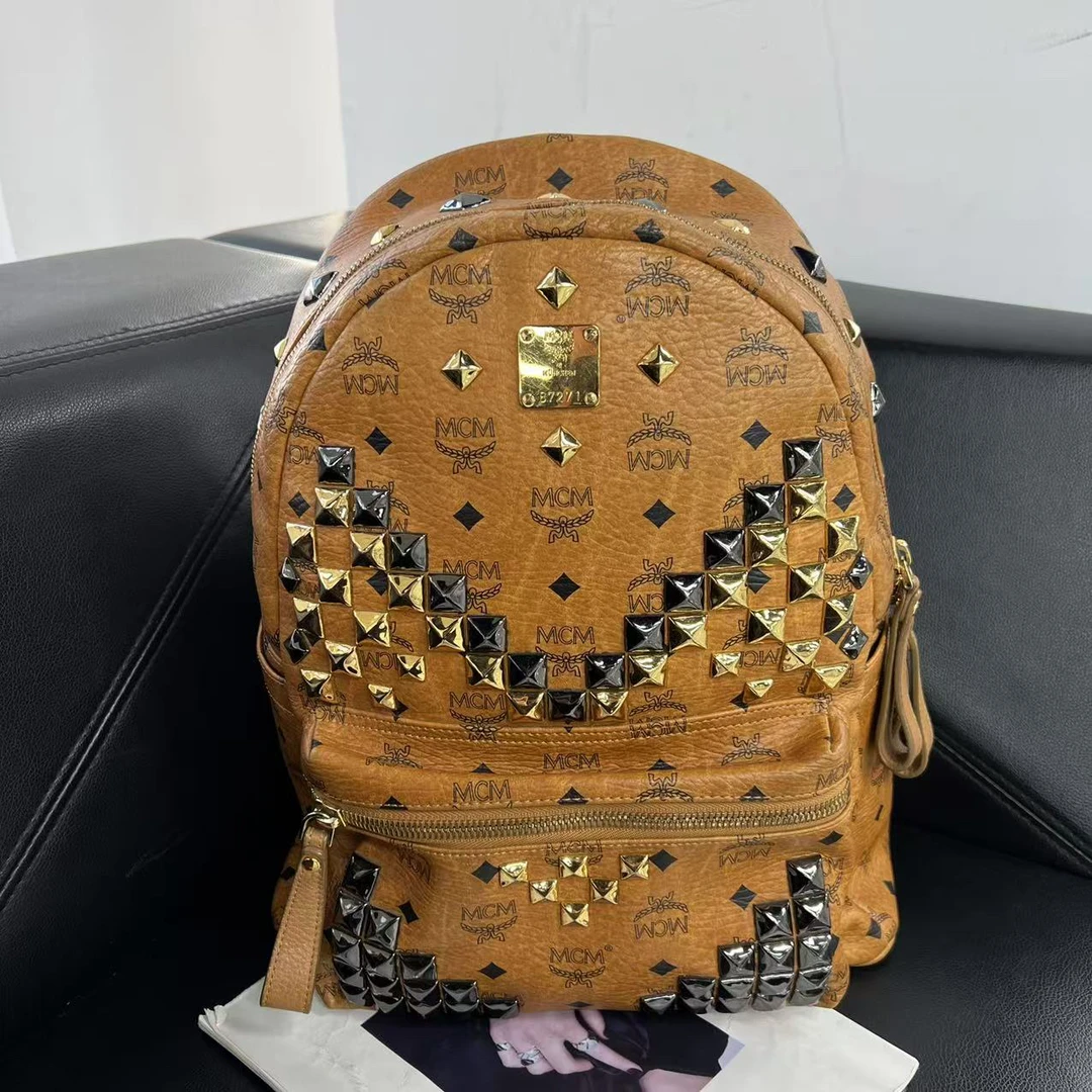 95新 MCM 捐金沉珠/大号干邑色双肩