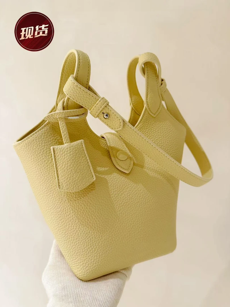 Chio2nd 晴空漫步鹅黄色水桶包包女2025超火春夏手提斜挎小包