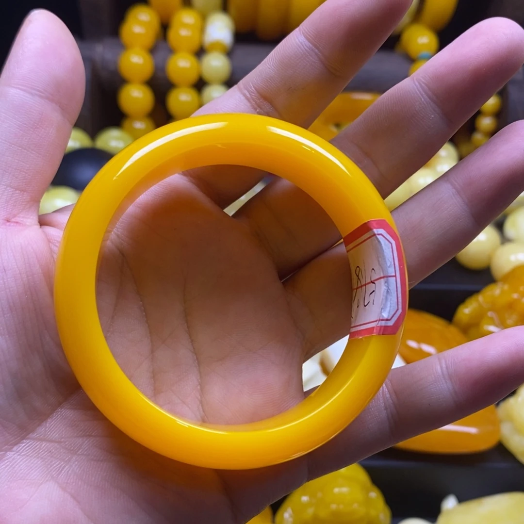 丹***姐非金属树脂全品无暇鸡油黄手镯