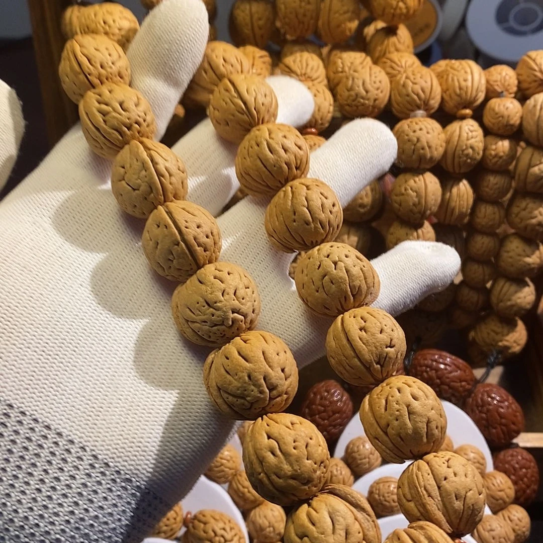 椰****手串桃核刀齐肉球