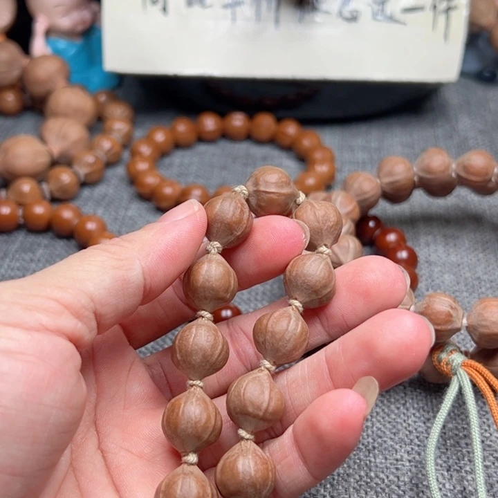 闫***队橄榄核手串1.2蜜桃18颗