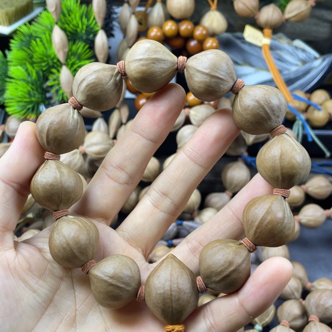 老***ㅤ吊坠橄榄核001.21x24红核