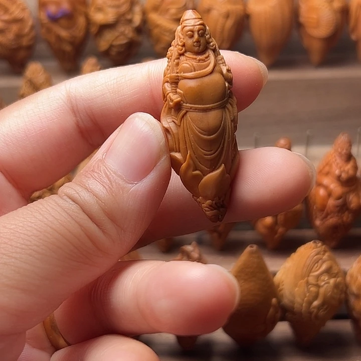 王***烤橄榄核吊坠橄榄核