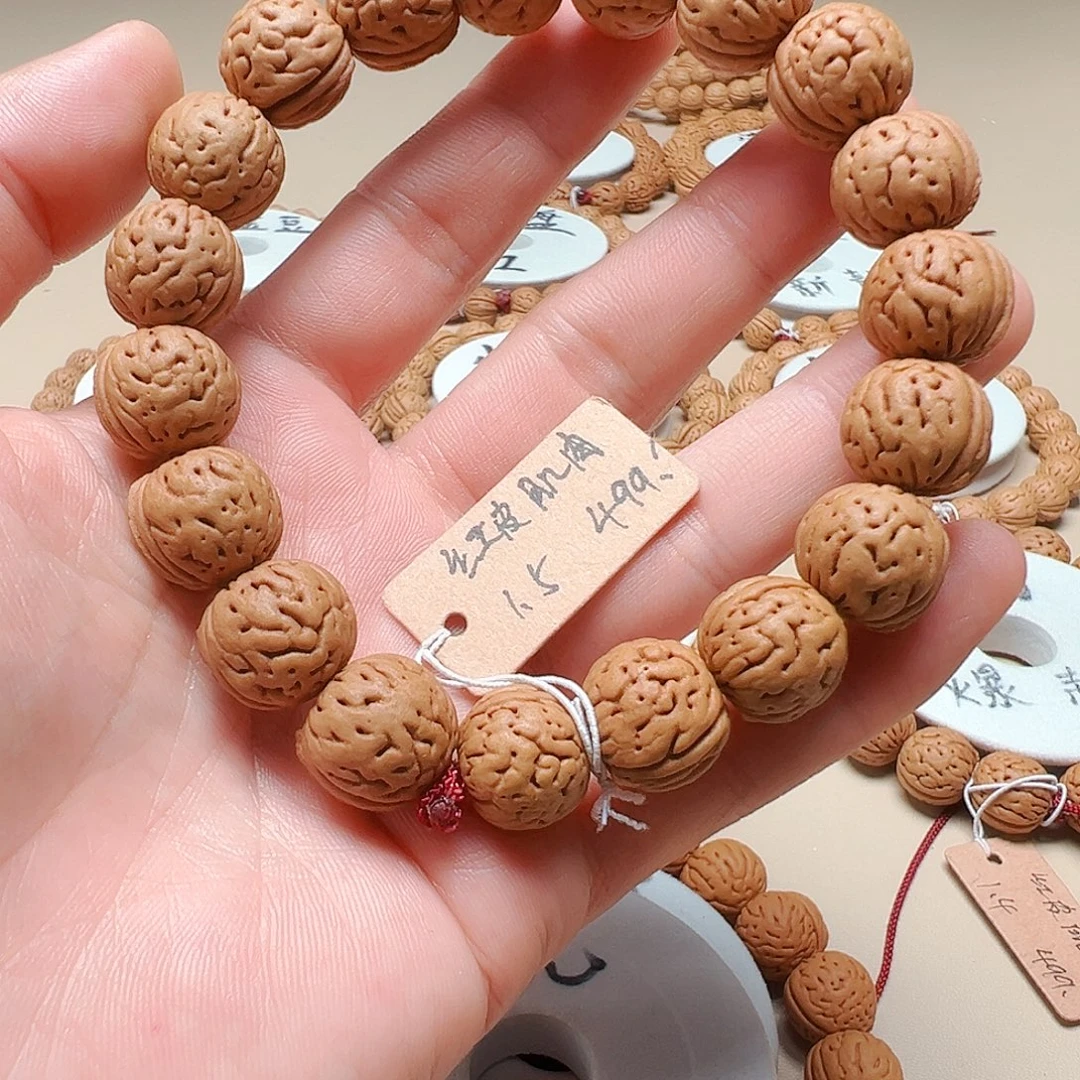 幼***牛桃核手串1.5红皮大肌肉精品