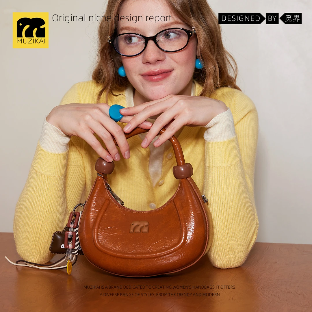 上班杂物小拎包包女式2025新款秋冬小众高级通勤斜挎月牙包