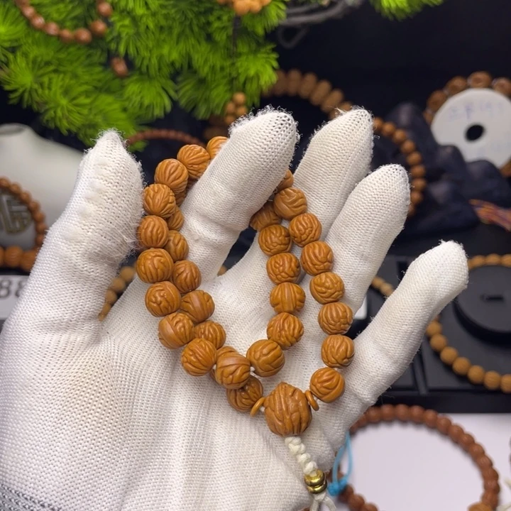 偷***孩桃核吊坠小金豆1.0