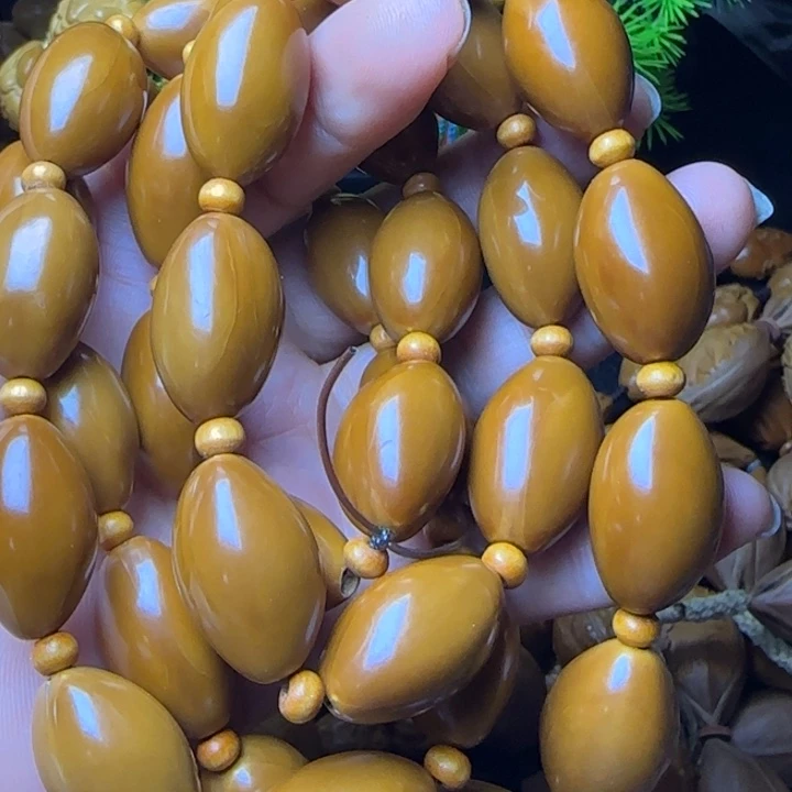 熬***鹰橄榄核雕刻手串光珠