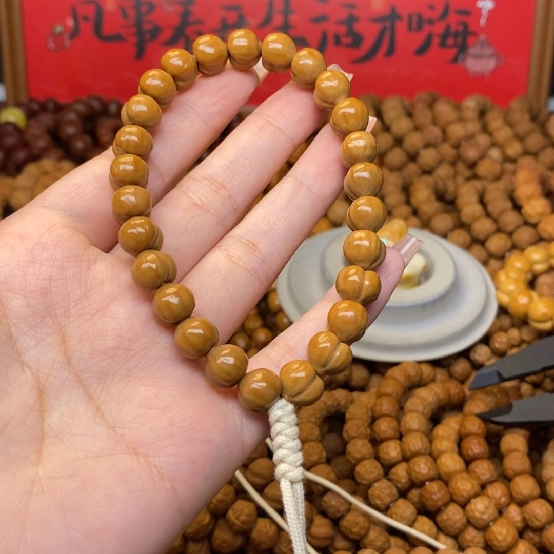 姜***.猴头核桃吊坠猴头全品小屁桃手持