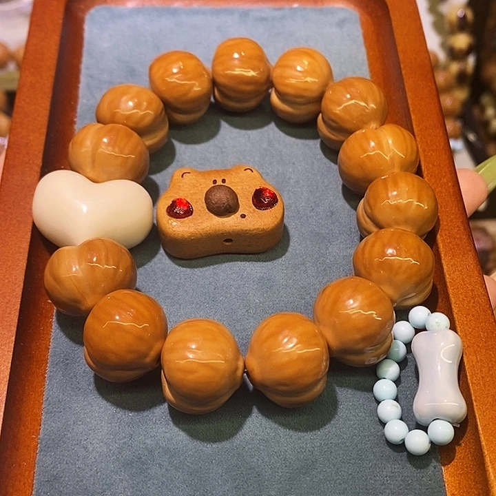 邵****猴头核桃手串屁桃小熊素浅蓝跑