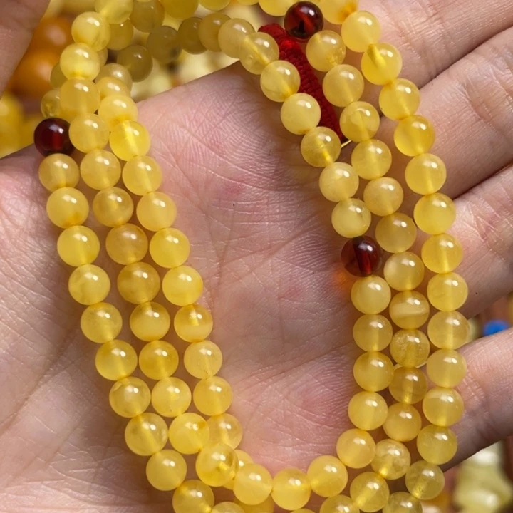 惹****蜜蜡未镶嵌珠宝奇石天然原矿蜜蜡108链子微微瑕