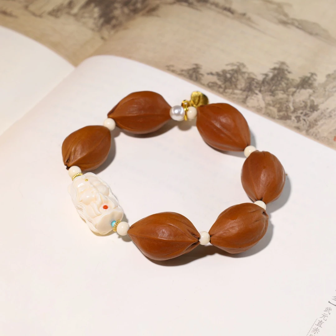 精雕绿度度橄榄核文玩手串