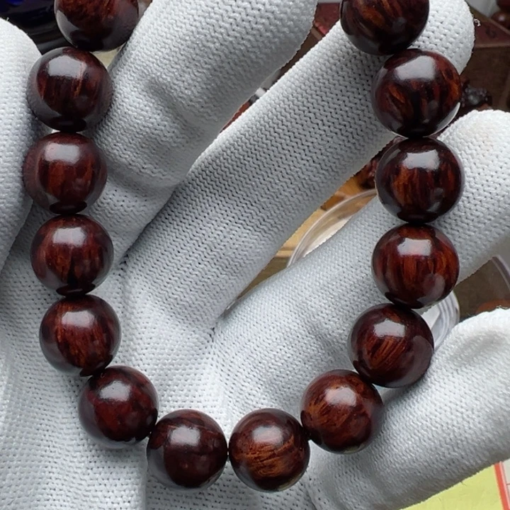 一***花木海南红降1.2圆珠黑金满文