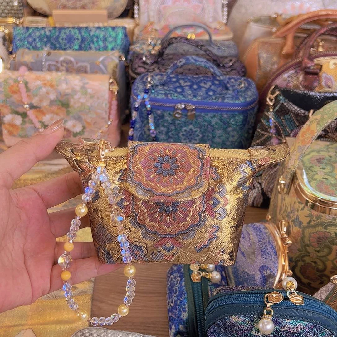 蚕丝宝相花小龙骧包