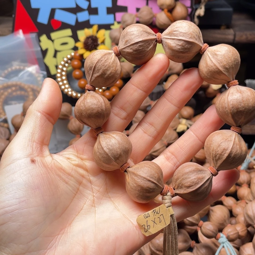 忧***猪橄榄核吊坠2627四花铁核