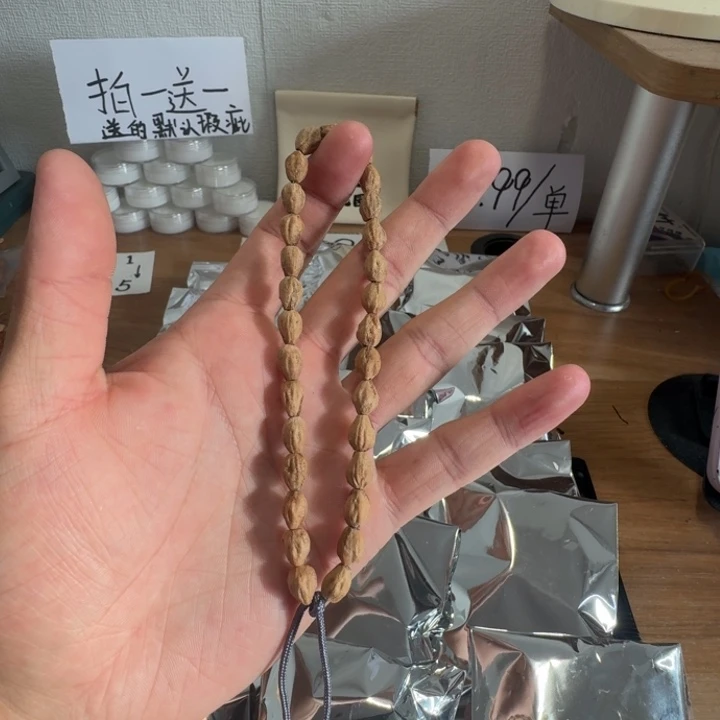 柏香籽/百香籽吊坠百香籽手持一条大长腿