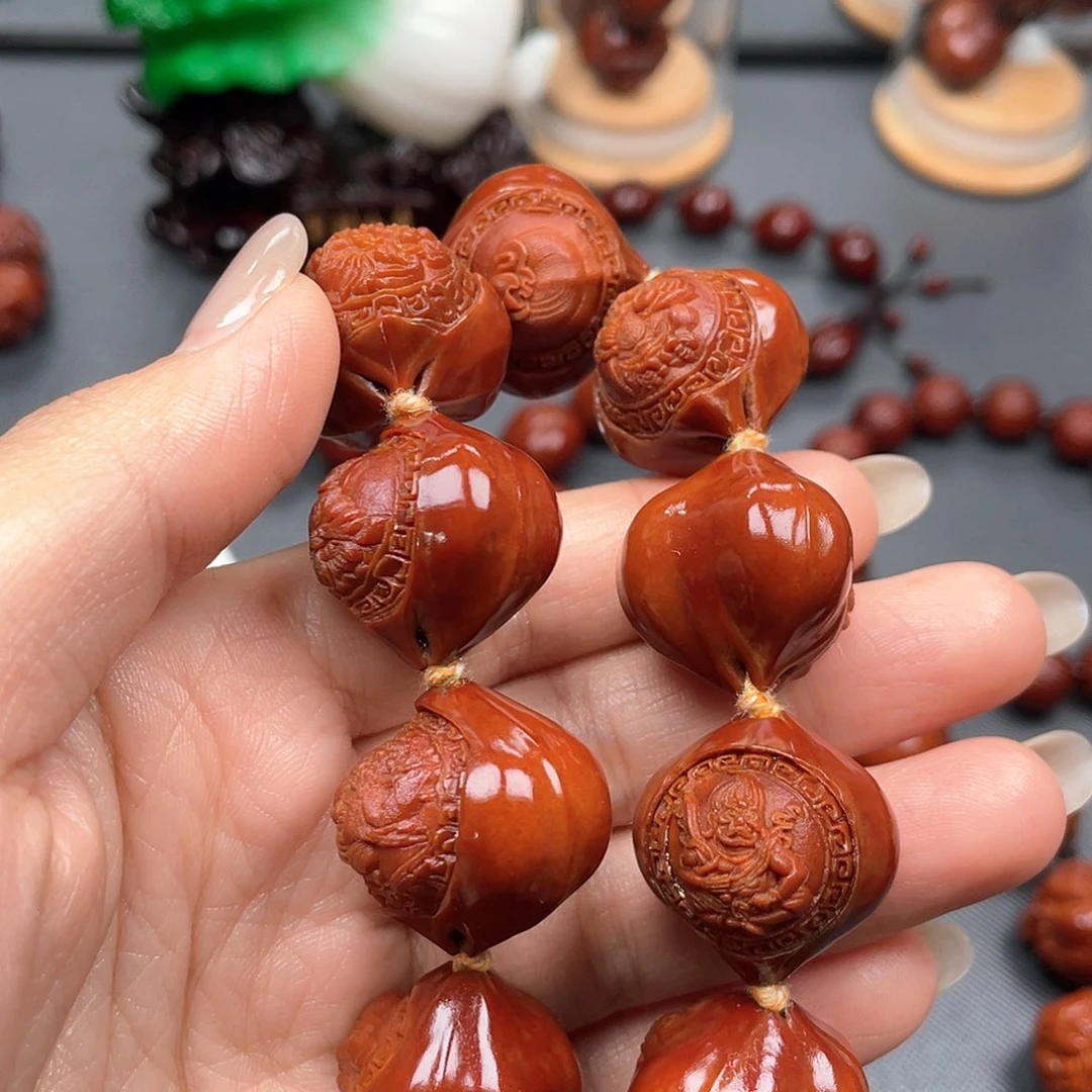 看***强手串橄榄核万佛手串